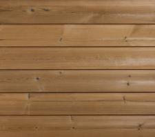 Nowość! Bryła budynku otulona naturalnym drewnem – elewacja z sosny termo firmy DLH Poland